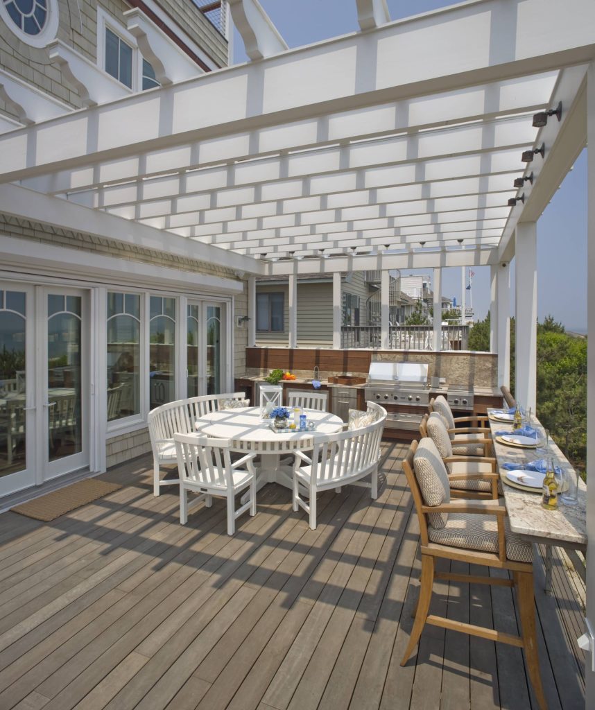 Example of a beach style deck design in DC Metro with a pergola