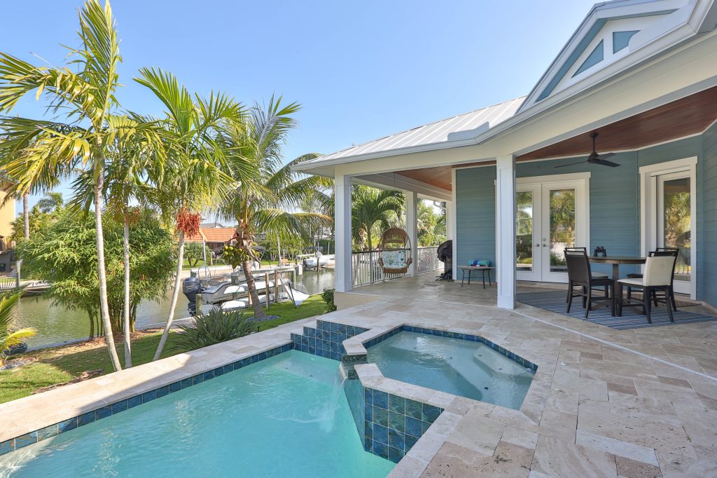 Example of a beach style pool design in Tampa