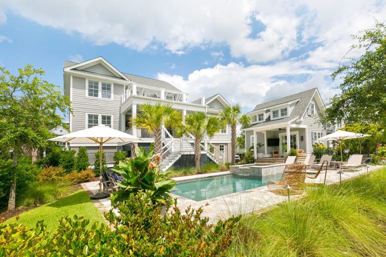 Example of a beach style tile and rectangular hot tub design in Charleston
