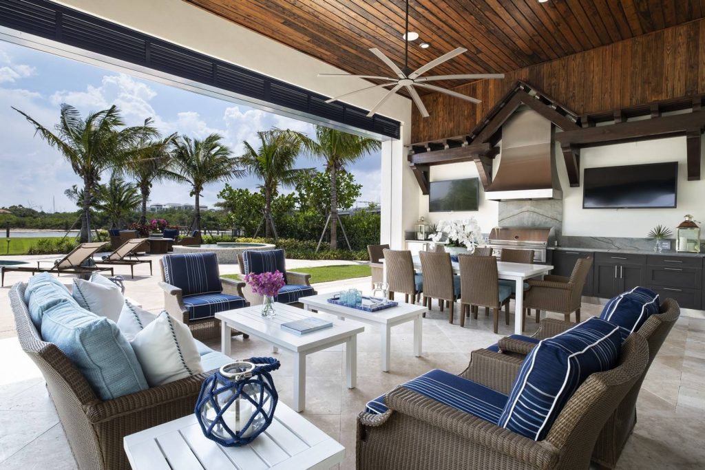 Example of a beach style tile patio kitchen design in Miami with a roof extension