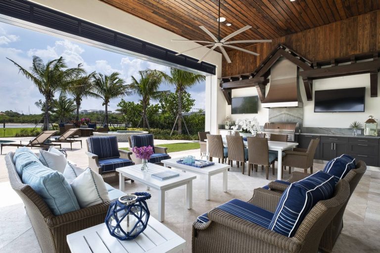 Example of a beach style tile patio kitchen design in Miami with a roof extension