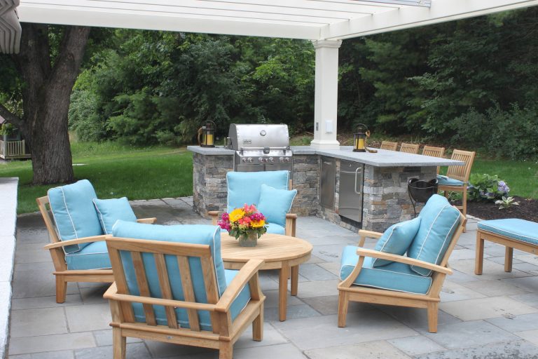 Example of a classic backyard patio kitchen design in Boston