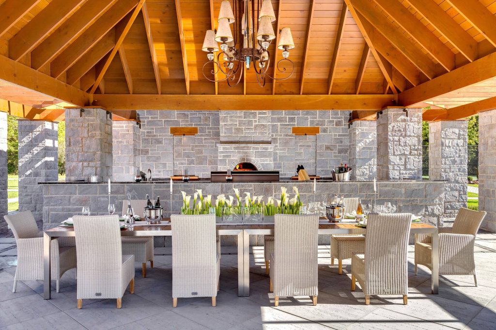 Example of a classic concrete patio kitchen design in Philadelphia with a gazebo