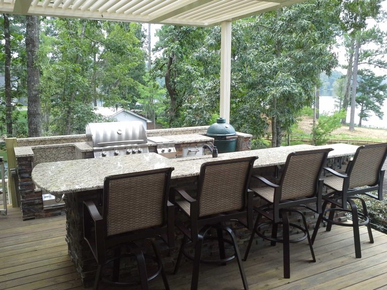 Example of a classic outdoor kitchen deck design in Other with a pergola