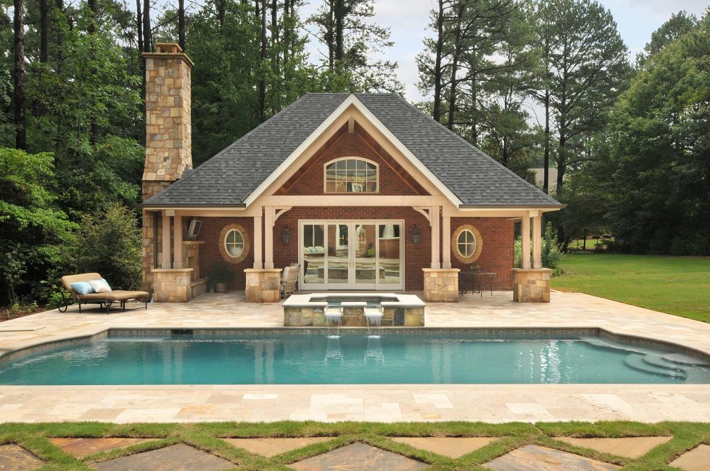 Example of a classic rectangular pool house design in Atlanta