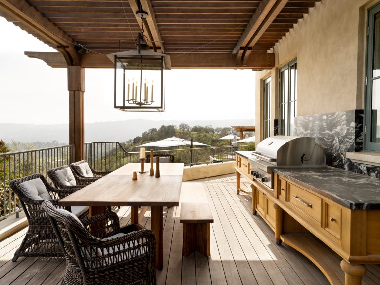 Example of a classic second story metal railing deck design in San Francisco with a roof extension