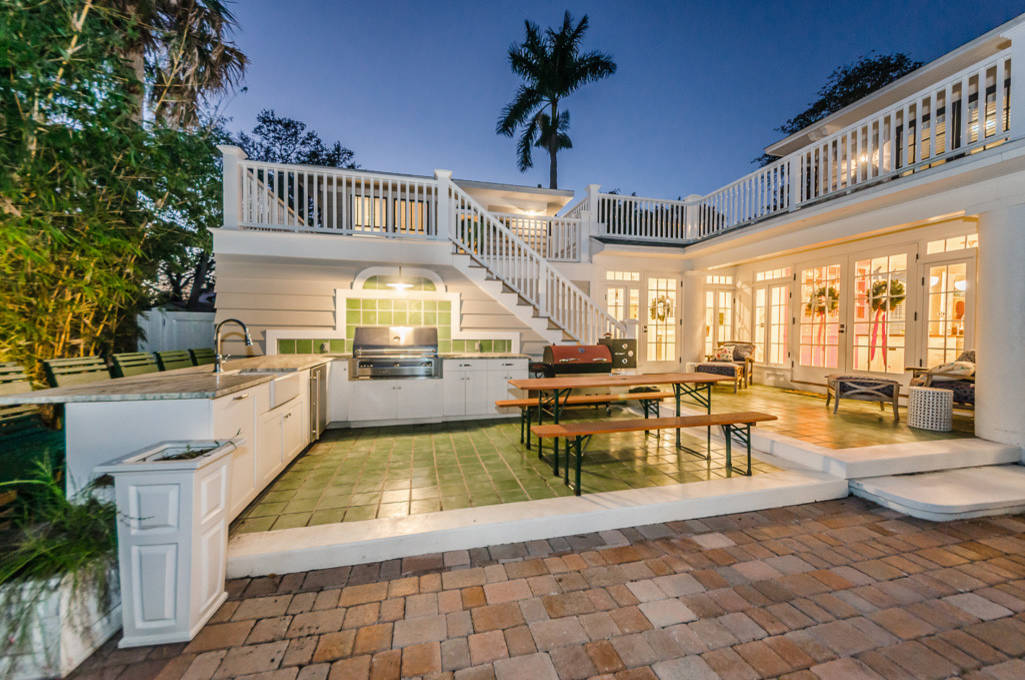 Example of a classic tile patio kitchen design in Tampa