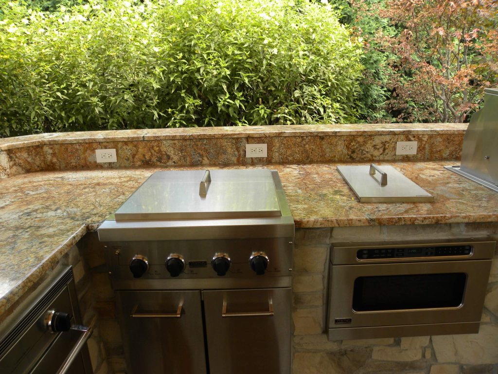 Example of a huge classic backyard patio kitchen design in Chicago with a gazebo