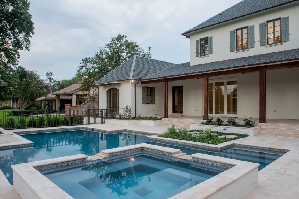 Example of a huge country backyard tile and rectangular hot tub design in New Orleans