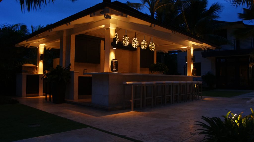 Example of a huge island style backyard tile patio kitchen design in Hawaii with a gazebo