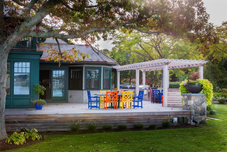 Example of a huge transitional backyard outdoor kitchen deck design in Boston with a pergola