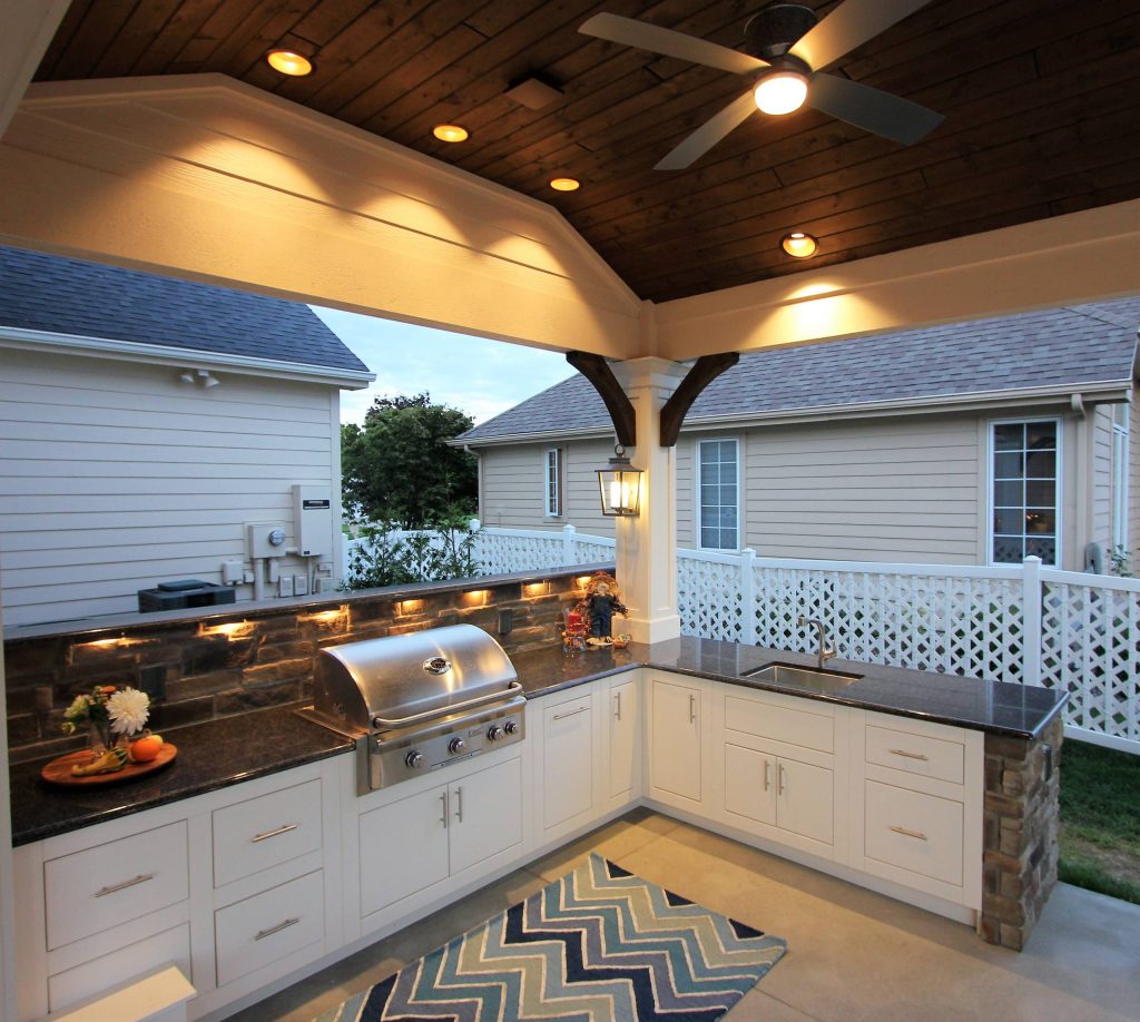 Example of a huge transitional backyard patio kitchen design in Other with decking and a roof extension