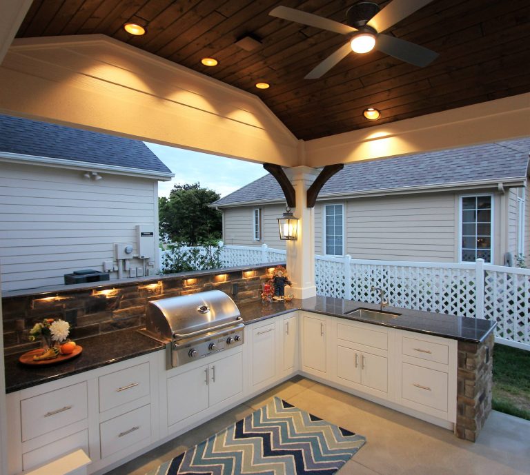 Example of a huge transitional backyard patio kitchen design in Other with decking and a roof extension