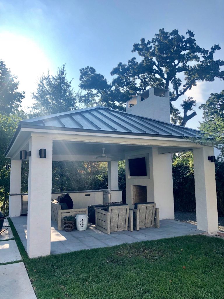 Example of a huge transitional backyard stone patio kitchen design in Houston with a gazebo