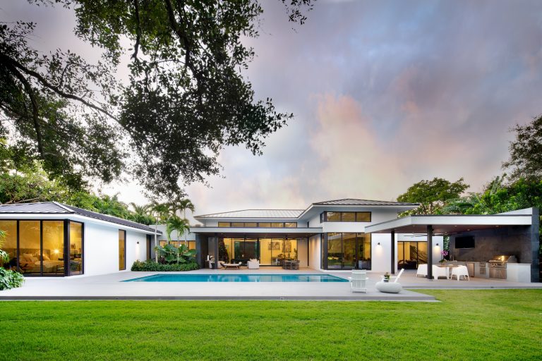Example of a huge trendy backyard concrete patio kitchen design in Miami