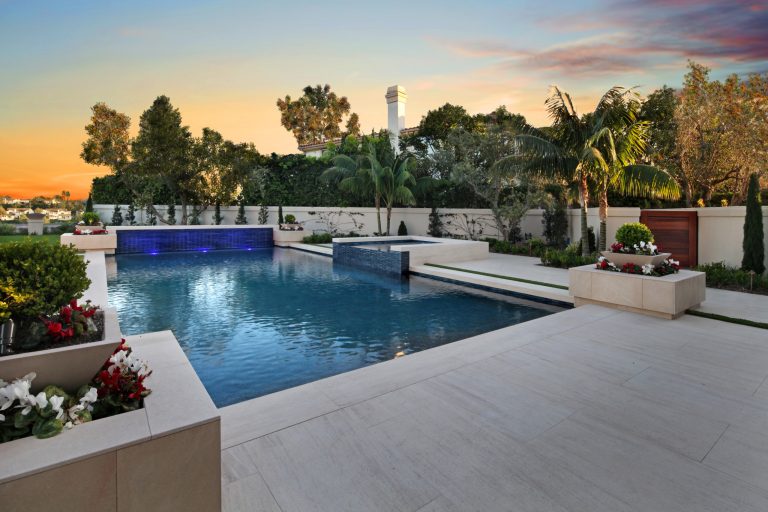 Example of a huge trendy backyard stone and rectangular hot tub design in Orange County