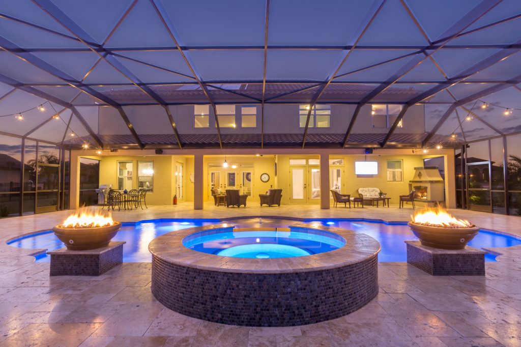 Example of a huge tuscan indoor stone and custom-shaped hot tub design in Orlando