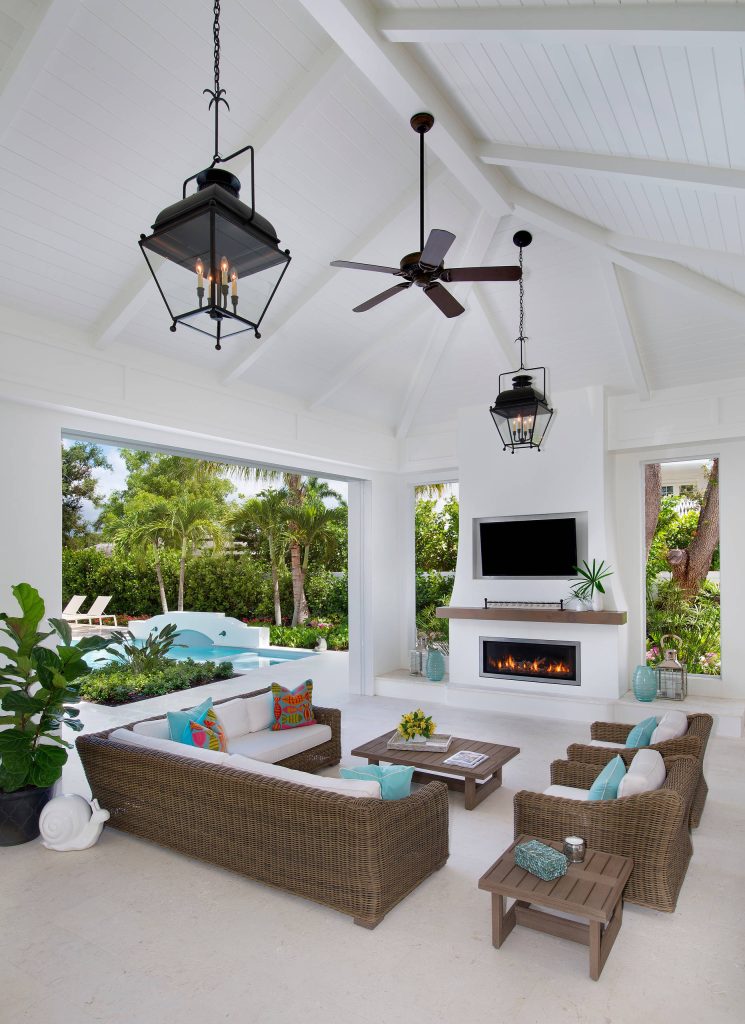 Example of a large beach style backyard patio kitchen design in Other with a roof extension