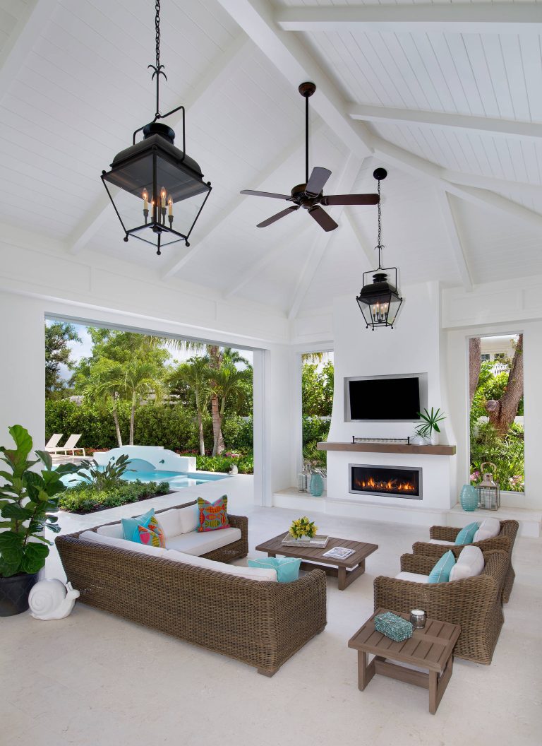 Example of a large beach style backyard patio kitchen design in Other with a roof extension