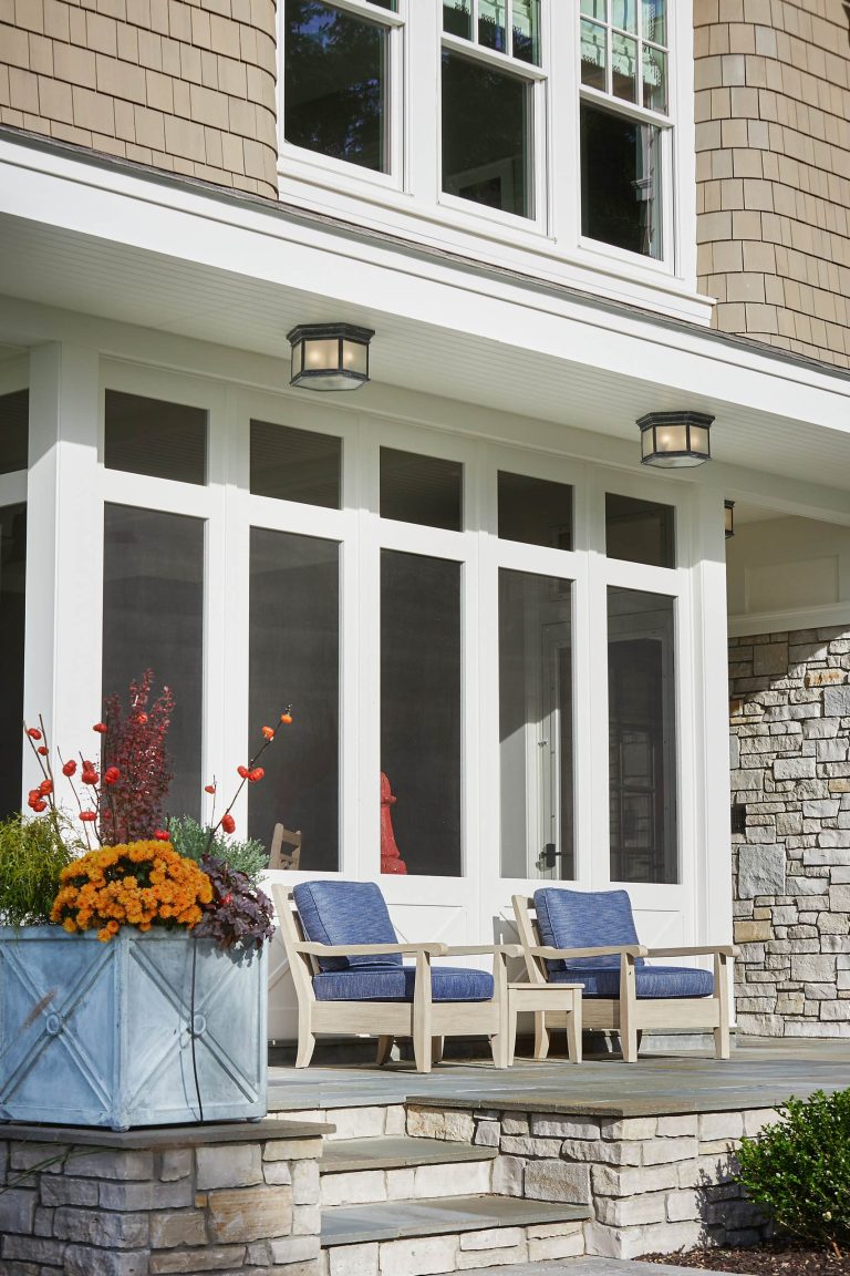 Example of a large classic backyard brick patio kitchen design in Grand Rapids with no cover