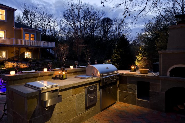 Example of a large classic backyard brick patio kitchen design in Minneapolis
