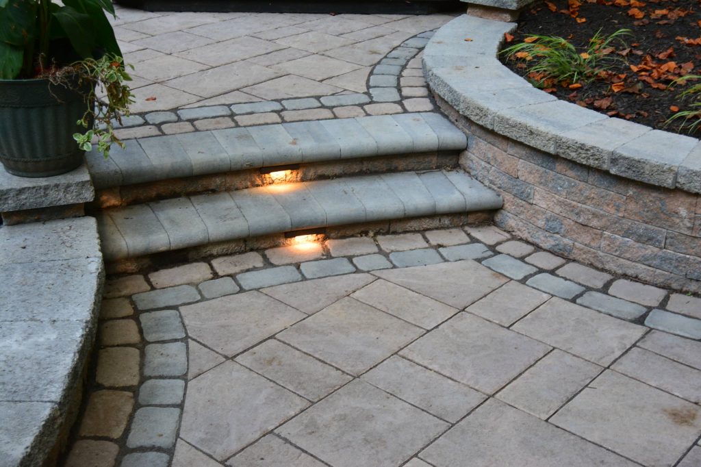 Example of a large classic backyard concrete paver patio kitchen design in Richmond with no cover