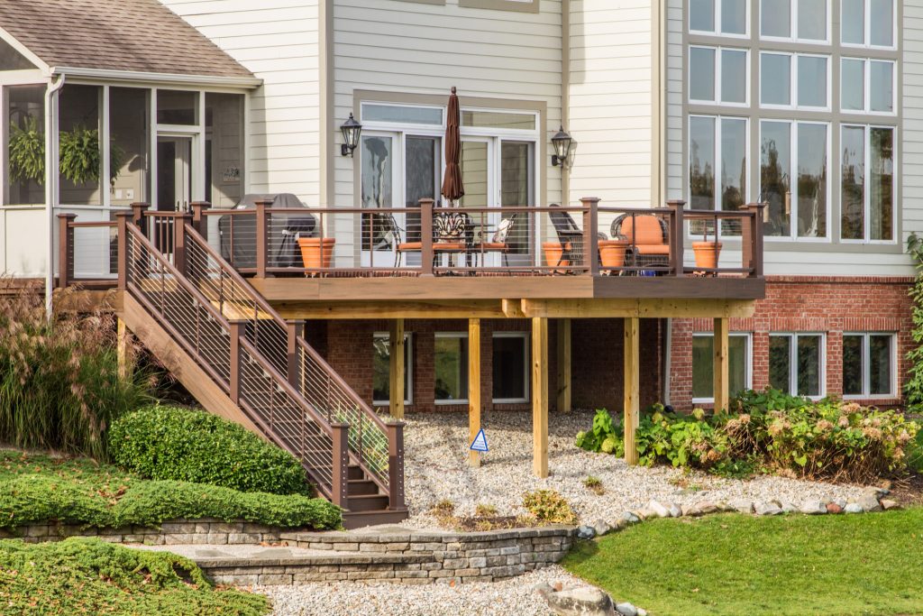 Example of a large classic backyard outdoor kitchen deck design in Indianapolis with no cover