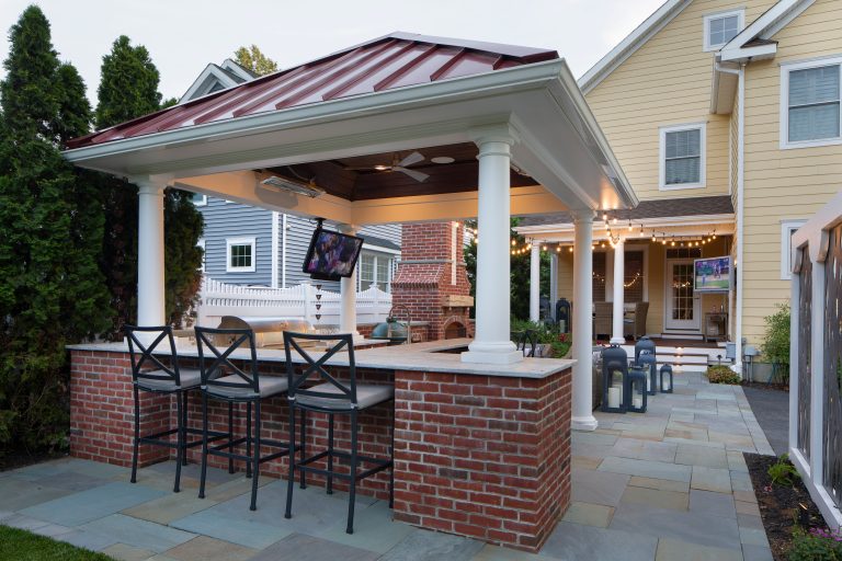 Example of a large classic backyard tile patio kitchen design in Philadelphia with a gazebo