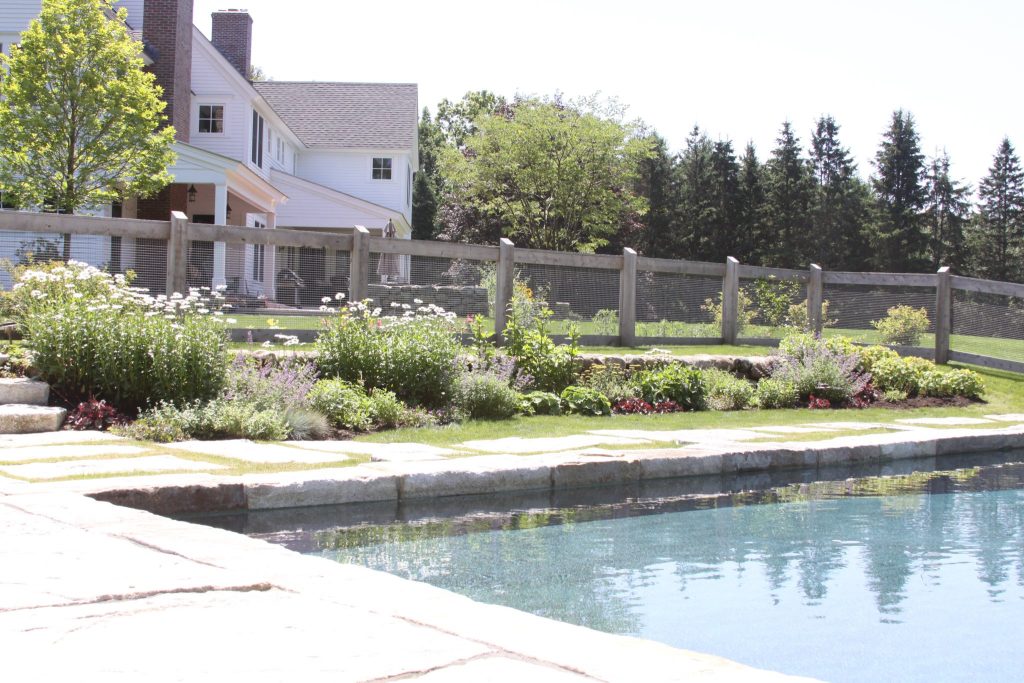 Example of a large country backyard rectangular and concrete paver lap pool design in Louisville