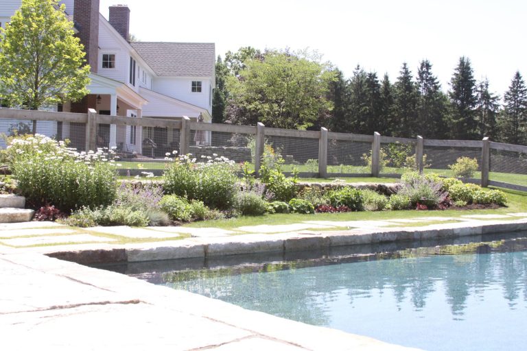 Example of a large country backyard rectangular and concrete paver lap pool design in Louisville