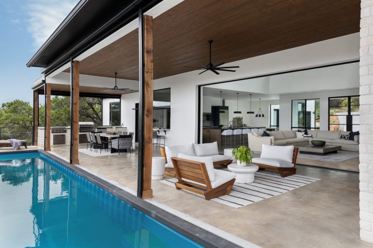 Example of a large danish backyard rectangular lap pool design in Austin