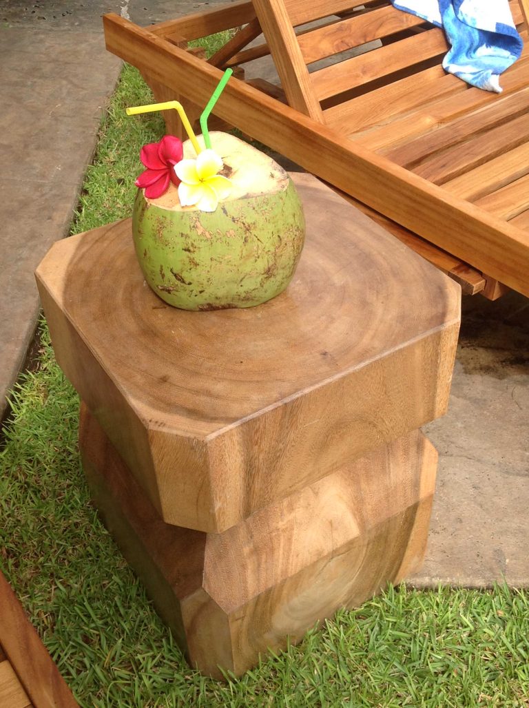 Example of a large island style backyard stamped concrete and custom-shaped infinity pool fountain design in Hawaii