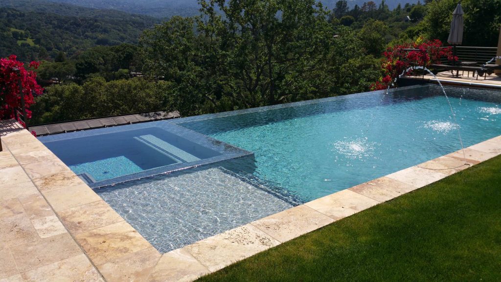 Example of a large minimalist backyard tile and rectangular infinity pool house design in San Francisco