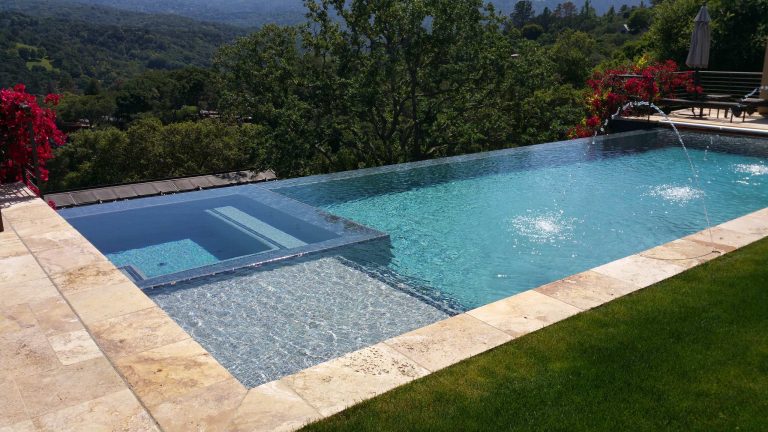 Example of a large minimalist backyard tile and rectangular infinity pool house design in San Francisco