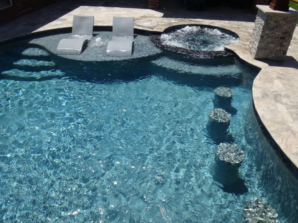Example of a large transitional backyard stone and custom-shaped lap hot tub design in Houston