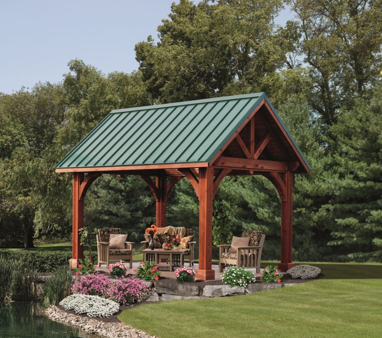 Example of a large transitional backyard stone patio kitchen design in Boston with a gazebo