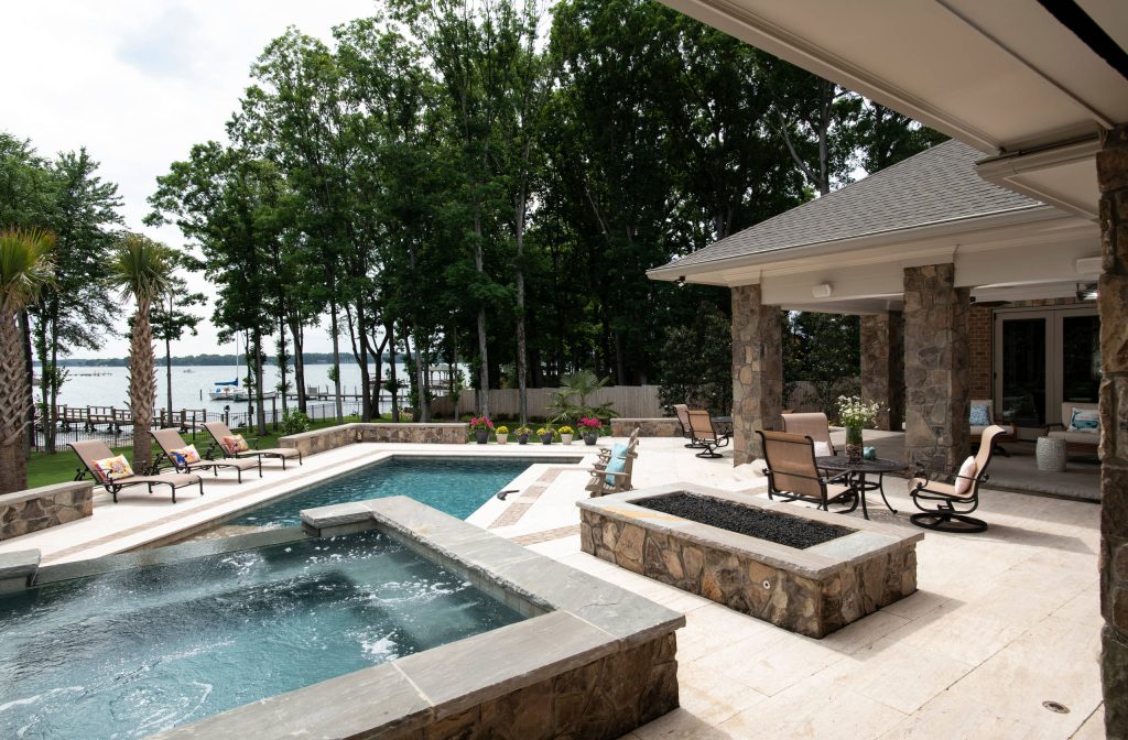 Example of a large transitional backyard tile and rectangular lap hot tub design in Charlotte