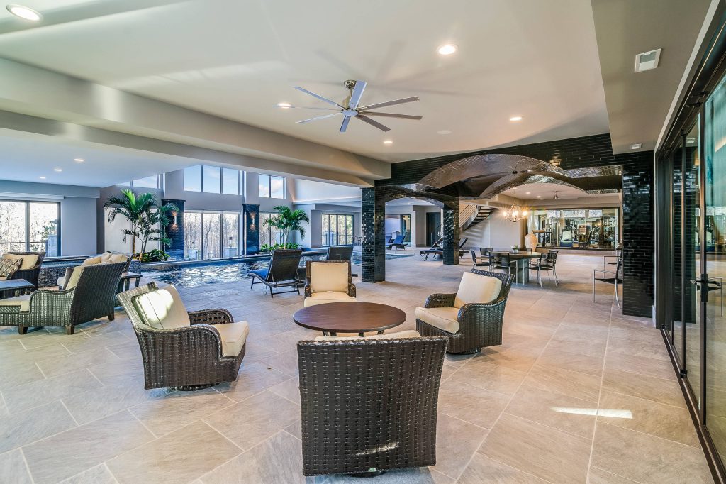 Example of a large transitional tile patio kitchen design in Columbus with a roof extension
