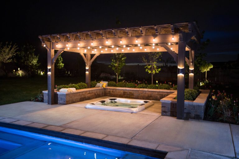 Example of a large trendy backyard concrete paver and rectangular lap hot tub design in Salt Lake City