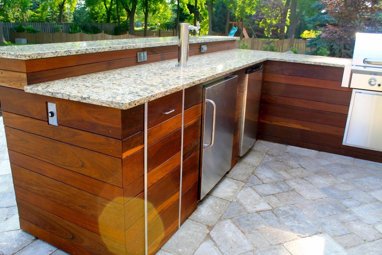 Example of a large trendy backyard concrete paver patio kitchen design in Indianapolis with no cover