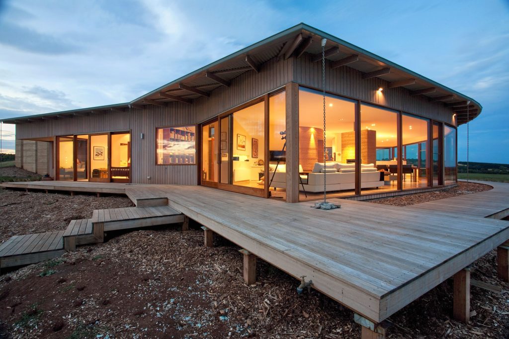 Example of a large trendy backyard deck design in Melbourne with no cover