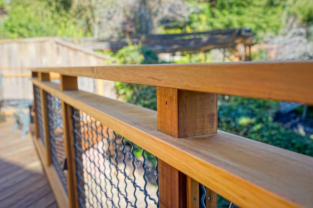 Example of a large trendy backyard outdoor kitchen deck design in San Francisco with no cover