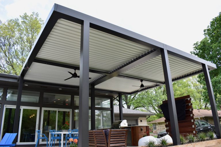Example of a large trendy backyard patio kitchen design in Indianapolis with decking and a pergola