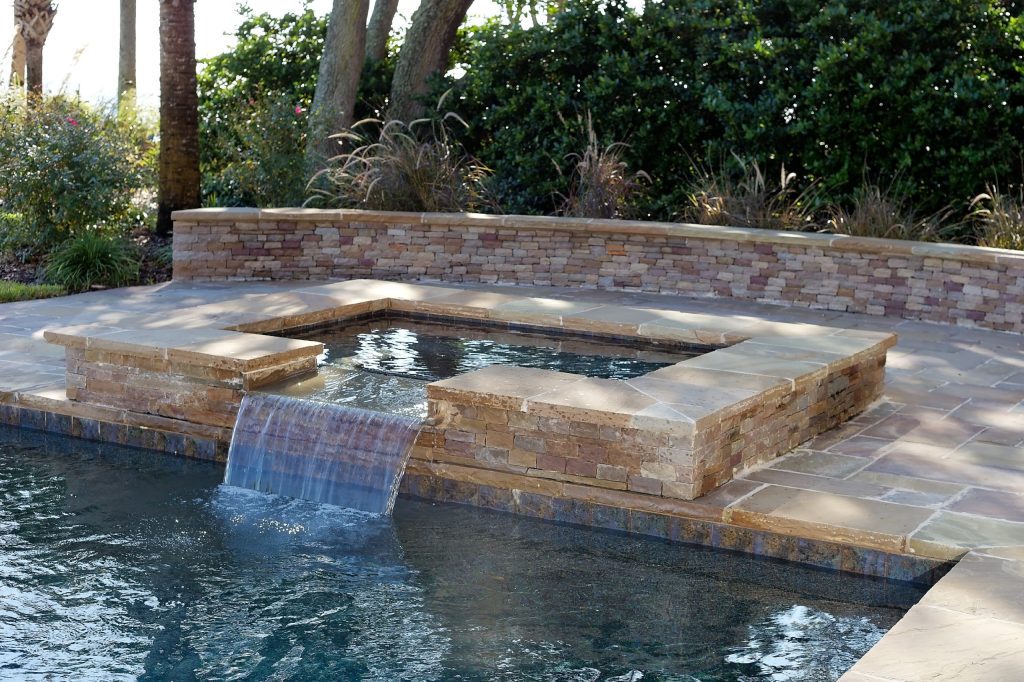 Example of a large trendy backyard stone and rectangular lap hot tub design in Atlanta