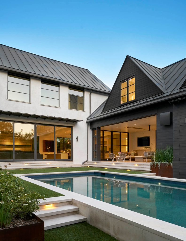 Example of a large trendy courtyard concrete paver and rectangular lap pool design in Dallas
