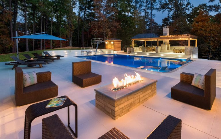 Example of a large trendy tile and rectangular pool house design in Atlanta