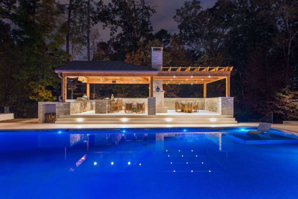 Example of a large trendy tile and rectangular pool house design in Atlanta