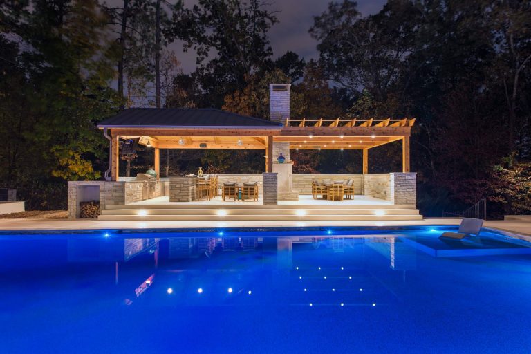 Example of a large trendy tile and rectangular pool house design in Atlanta