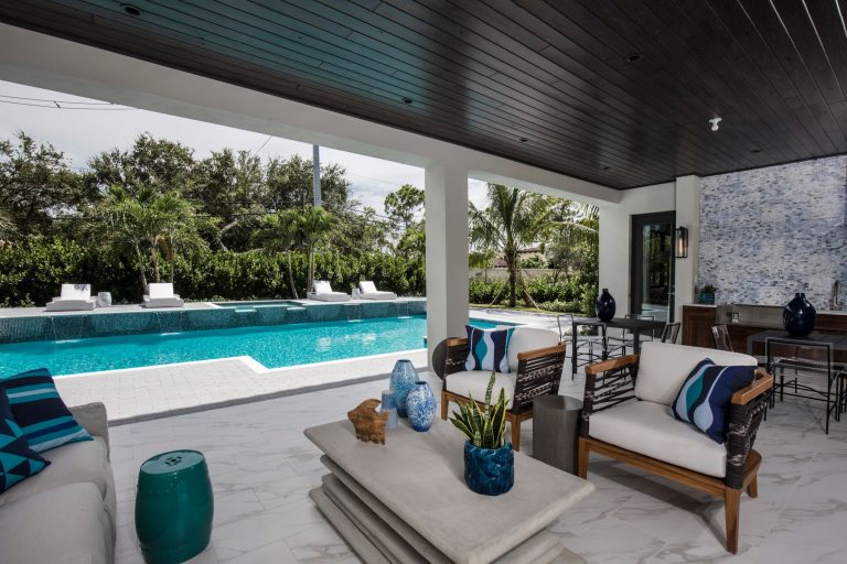 Example of a large tuscan backyard patio kitchen design in Other with a roof extension