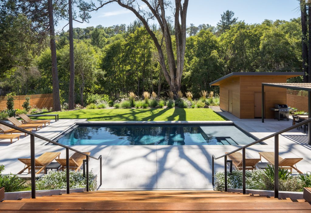Example of a mid-sized 1960s backyard concrete and rectangular natural pool landscaping design in San Francisco